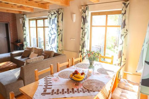 a living room with a table with fruit on it at Chata u Gregora v Slovenskom raji in Smižany