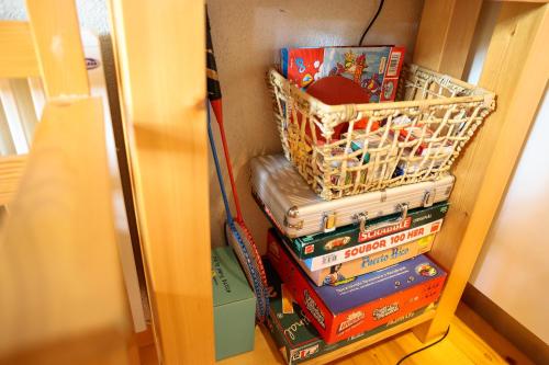 a stack of books with a basket on top at Chata u Gregora v Slovenskom raji in Smižany