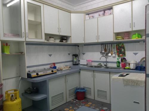 Virtuvė arba virtuvėlė apgyvendinimo įstaigoje Netasha holiday inn and apartment