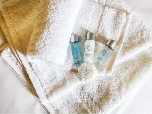two bottles ofodorizers sitting on top of a towel at The Feversham in York