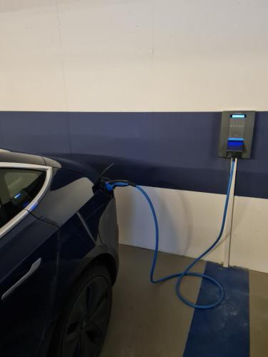 a car is plugged into a electric car charger at Tourist Hotel in Bressanone
