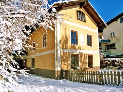 a house in the snow with a fence at Chalet Dr-Steiner by Interhome in Zell am See