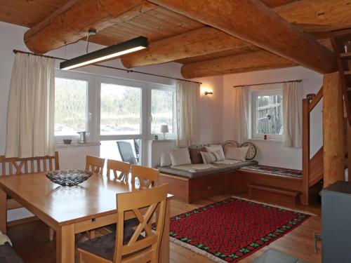 a living room with a table and a couch at Holiday Home Nikola - FLU100 by Interhome in Flachau