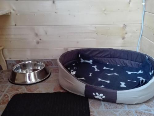 a dog bowl and a dog dish on a floor at Chalet Waltl by Interhome in Fusch an der Glocknerstraße