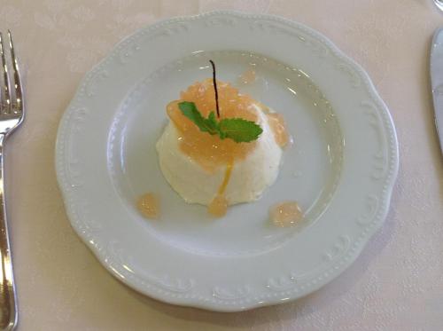 a white plate with a dessert on a table at Domus Australia in Rome