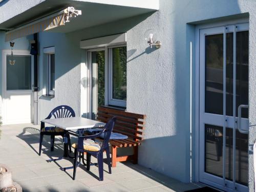 a patio with a table and chairs and a bench at Apartment Apartment Frisch by Interhome in Imst