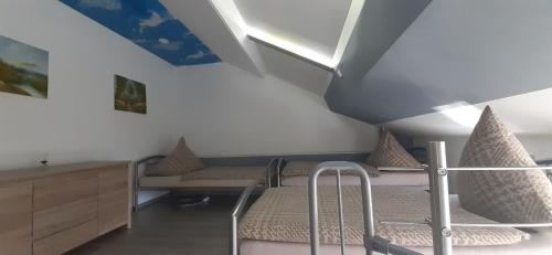 a hospital room with two beds and a ceiling at Stumpf Verpachtung Gbr in Treuchtlingen