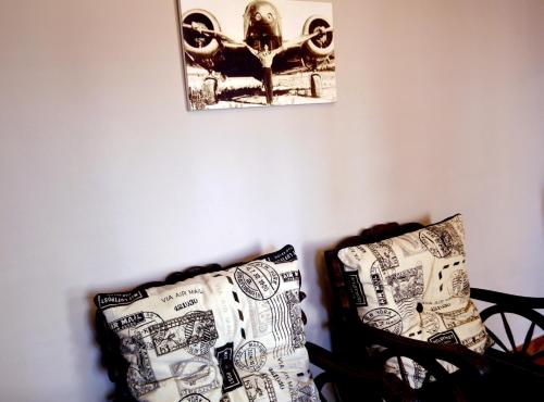 a room with two chairs and a picture on the wall at Barnstormers Rest in Malelane