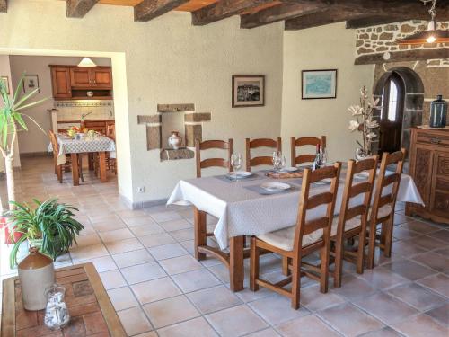 a kitchen and dining room with a table and chairs at Holiday Home Maner Penfrat by Interhome in Kerlouan
