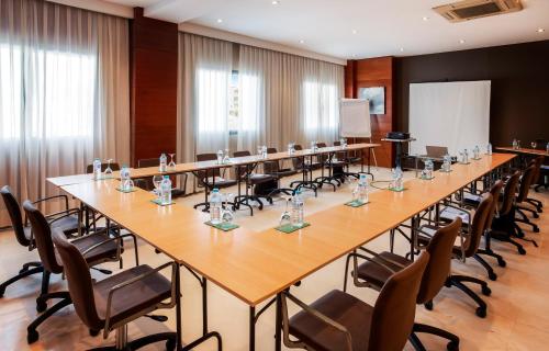 a large conference room with a long table and chairs at B&B HOTEL Granada Estación in Granada