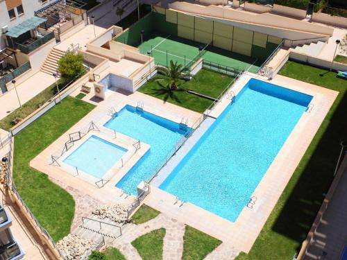 an overhead view of two swimming pools in a house at Apartment Tamarindo by Interhome in Cala de Finestrat