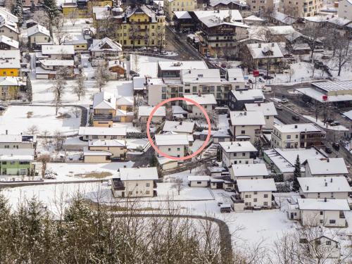a city covered in snow with a red circle at Holiday Home Ötztal by Interhome in Oetz