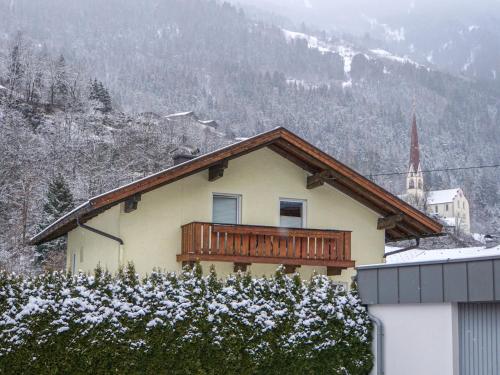 a house with a balcony with snow on it at Holiday Home Ötztal by Interhome in Oetz