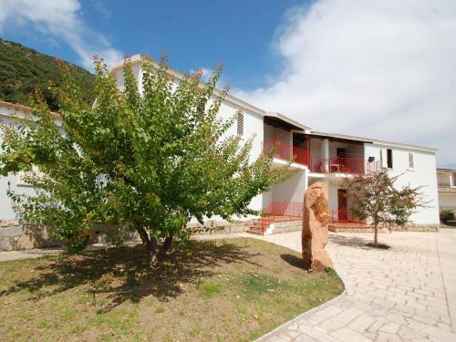 a statue of a bear in front of a building at Apartment Is Murtas-5 by Interhome in Cardedu