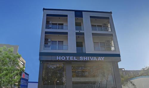 a hotel shinatown sign in front of a building at Treebo Trend Shivaay in Indore