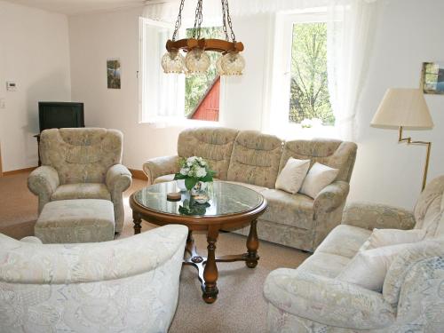 A seating area at Apartment Altes Forsthaus Sösetal by Interhome