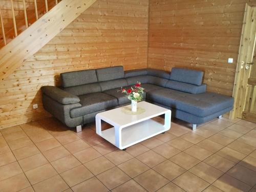 a living room with a couch and a table at Holiday Home Funke by Interhome in Hasselfelde