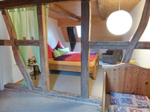 a bedroom with a bed in a wooden room at Holiday Home Haus Schwärzel by Interhome in Neuried