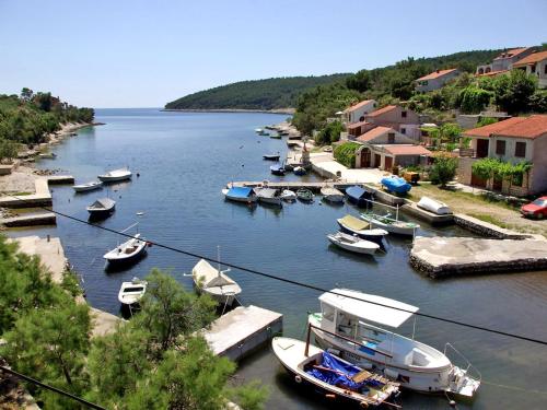 a group of boats are docked in a harbor at Apartment Šarenko-2 by Interhome in Vela Luka