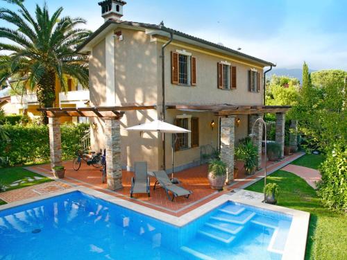 a house with a swimming pool in front of a house at Villa Roberto by Interhome in Casa Gherardi