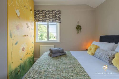Llit o llits en una habitació de Conker Tree House