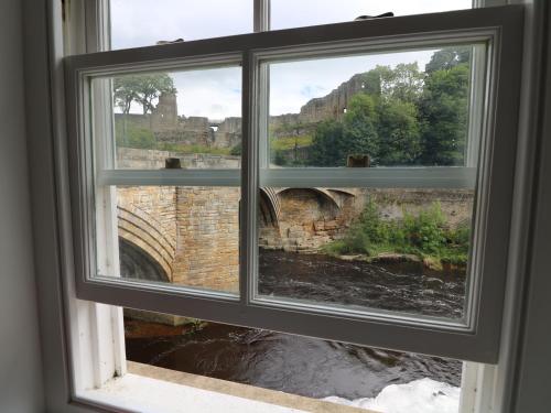 a window with a view of a bridge at 2 Riverside in Barnard Castle