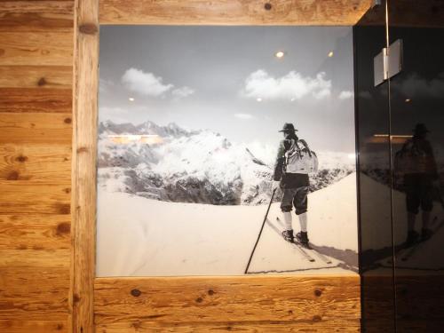 a picture of a man on skis on a mountain at Apartment Schweiberer-3 by Interhome in Aschau