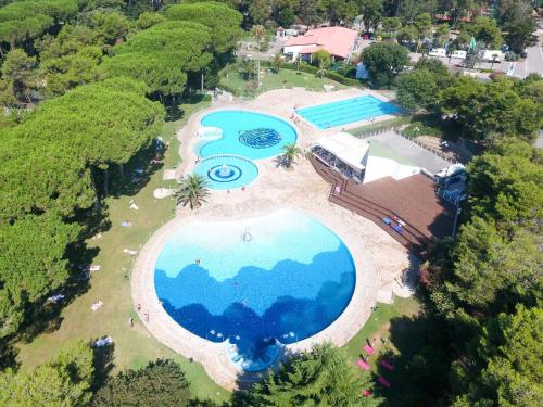 an overhead view of a large swimming pool in a resort at Holiday Home Luxury Tent by Interhome in Baia Domizia