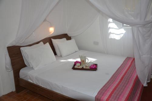 Postel nebo postele na pokoji v ubytování Kokogrove Chalets
