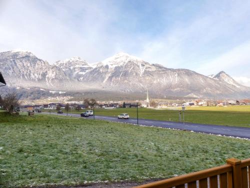 a view of a mountain range with cars on a road at Apartment Brettfall Blick by Interhome in Strass im Zillertal