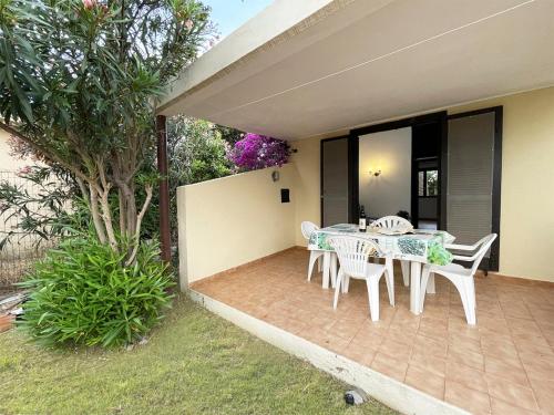 a patio with a table and chairs on it at Holiday Home Ada by Interhome in Monte Nai
