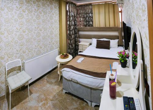 Ένα ή περισσότερα κρεβάτια σε δωμάτιο στο Florya House Hotel
