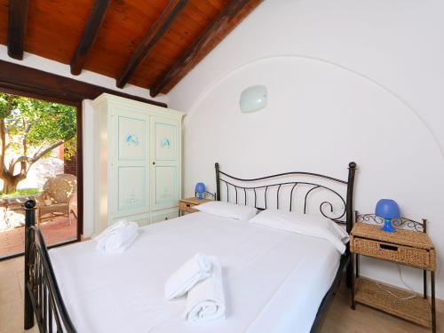 Posteľ alebo postele v izbe v ubytovaní Holiday Home Ville San Pietro - REI352 by Interhome