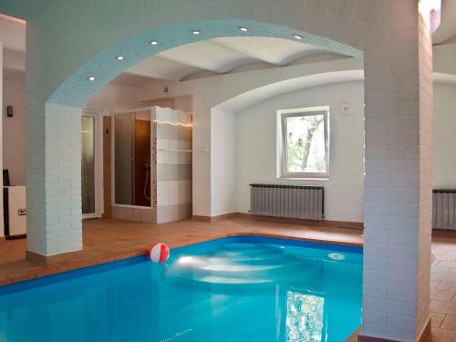 a swimming pool in a house with an archway at Holiday Home Chrastov by Interhome in Černov