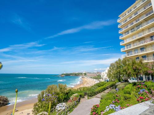 a view of a beach and a building at Apartment Bellevue Clemenceau-1 by Interhome in Biarritz