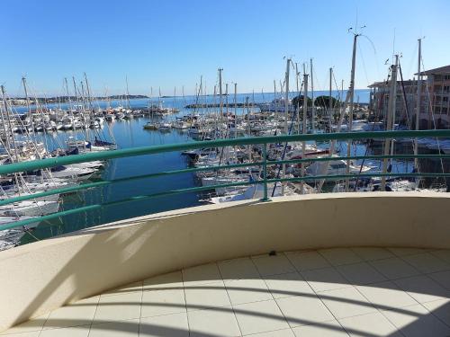 a view of a marina from a balcony at Apartment L'Open-2 by Interhome in Fréjus