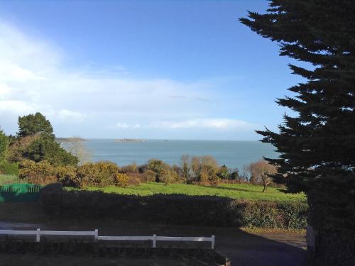 a view of the ocean from a park at Holiday Home Les Rimains by Interhome in Cancale
