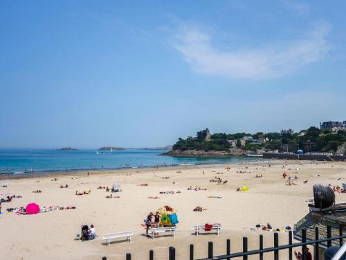 a beach with a lot of people on it at Apartment La Plage-1 by Interhome in Dinard