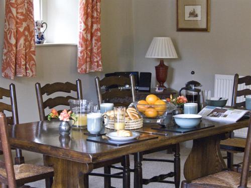 a wooden table with a bunch of food on it at Town Head Farm in Malham