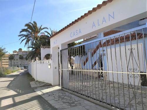 a gate in front of a white building at Holiday Home Alan by Interhome in Albir