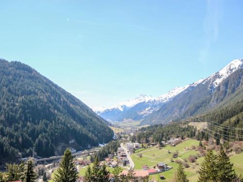 a view of a valley with snow covered mountains at Holiday Home Hölzl by Interhome in Flirsch