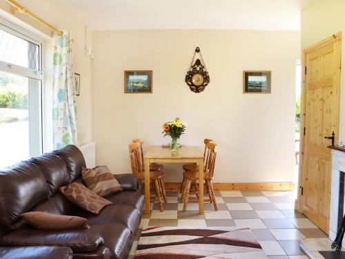 a living room with a couch and a table at Clash-Brack in Dungarvan