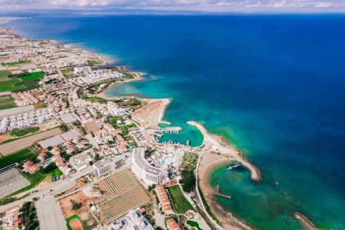 an aerial view of the beach and the ocean at SunnyVillas: 2BR New Villa☆Private Pool in Pernera - Nicholas in Protaras