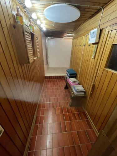 a small room with a tiled floor in a bathroom at FeWo bei Tati - Bungalow in Singen
