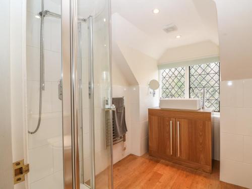 a bathroom with a shower and a sink at Hoath House in Chiddingstone