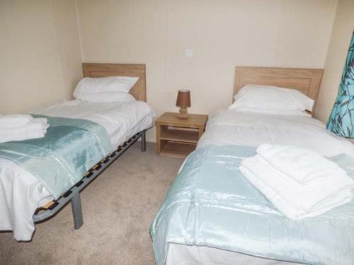 Ένα ή περισσότερα κρεβάτια σε δωμάτιο στο Whorlton Lodge