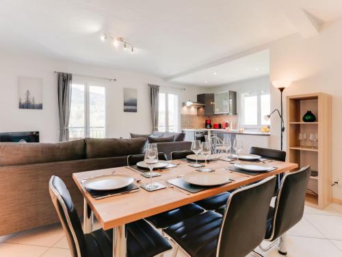 a dining room and living room with a table and chairs at Apartment Les Gentianes by Interhome in Saint-Gervais-les-Bains