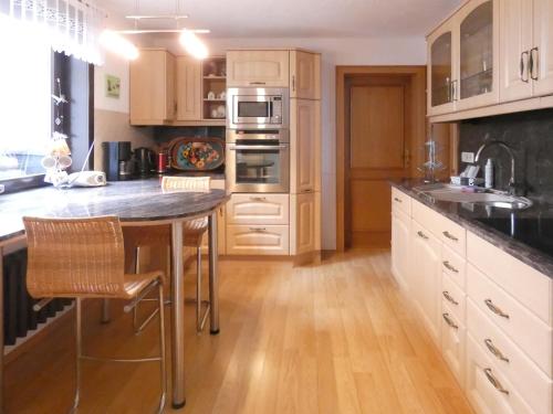 a kitchen with a large island with a sink at Apartment Petra-2 by Interhome in Frankenhain