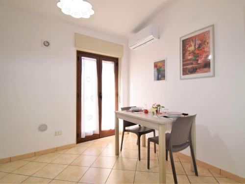 a dining room with a table and chairs at Apartment Zagara SinAgo by Interhome in Lascari