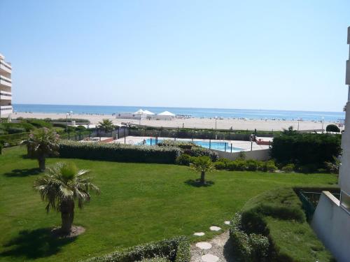 a view of the beach from the balcony of a resort at Apartment Grand Sud-16 by Interhome in Canet-en-Roussillon